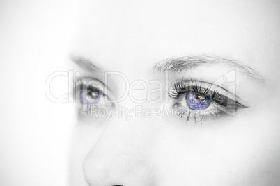 Composite image of close up of female blue eyes