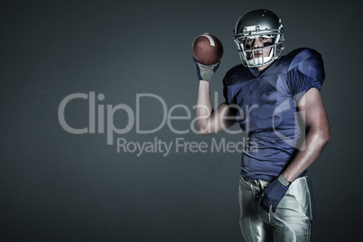 Composite image of portrait of american football player in uniform throwing ball