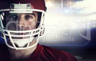 Composite image of american football player looking at camera