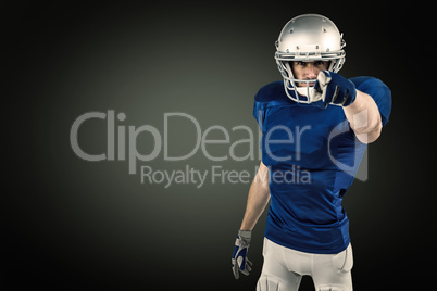 Composite image of portrait of confident sports player pointing