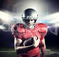 Composite image of portrait of confident sportsman holding ameri