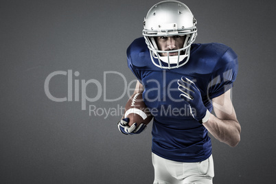 Composite image of portrait of american football player running with ball