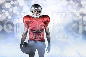 Composite image of portrait of american football player holding