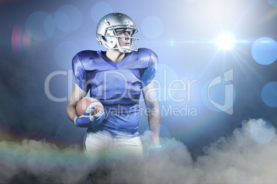 Composite image of confident american football player looking aw