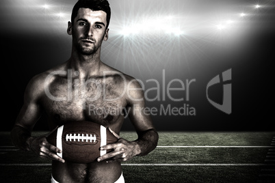 Composite image of portrait of shirtless rugby player with the b