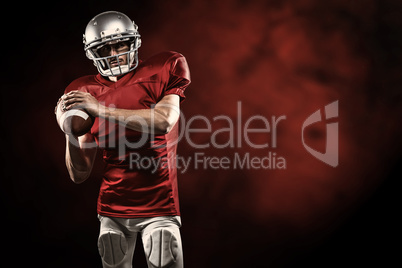 Composite image of confident american football player in red jer