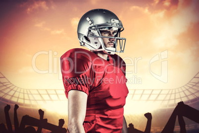 Composite image of serious american football player in red jerse