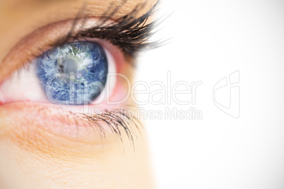 Composite image of close up of female blue eye