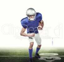Composite image of portrait american football player holding bal
