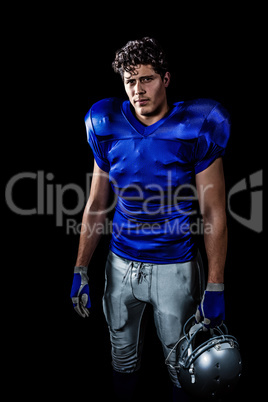 Composite image of portrait of confident american football playe