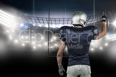 Composite image of rear view of american football player pointin