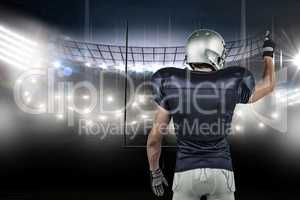 Composite image of rear view of american football player pointin
