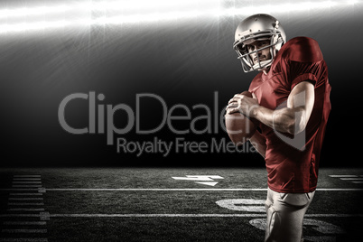 Composite image of serious american football player in red jerse
