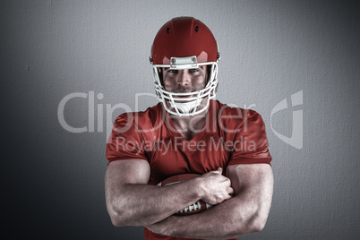 Composite image of american football player with ball