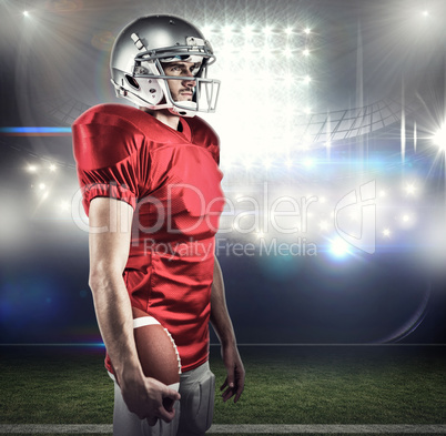 Composite image of serious american football player in red jerse