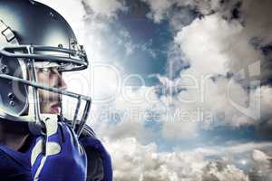 Composite image of sportsman wearing helmet looking away