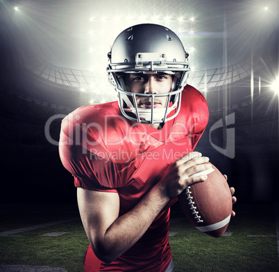 Composite image of portrait of determined sportsman holding amer
