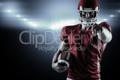 Composite image of american football player pointing at camera