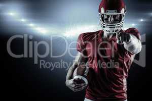 Composite image of american football player pointing at camera