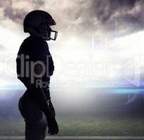 Composite image of side view of silhouette american football pla