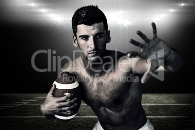 Composite image of shirtless rugby player defending