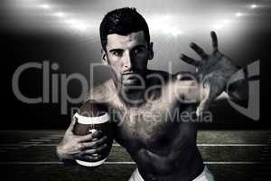 Composite image of shirtless rugby player defending