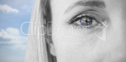 Composite image of close up of focused blonde looking at camera