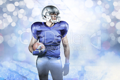 Composite image of confident american football player looking aw