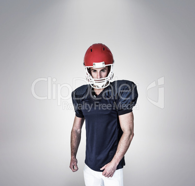 Composite image of portrait of a rugby player in blue posing