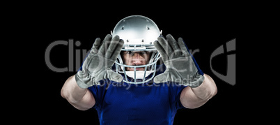 Composite image of portrait american football player defending