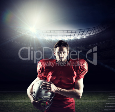 Composite image of confident american football player in red jer