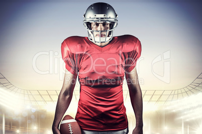 Composite image of portrait of american football player holding