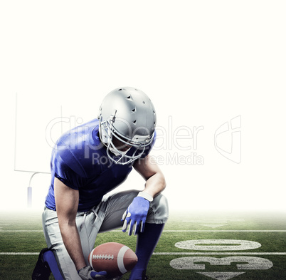 Composite image of american football player kneeling while holdi