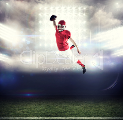 Composite image of american football player scoring a touchdown