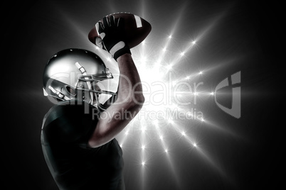 Composite image of porfile view ofamerican football player catch