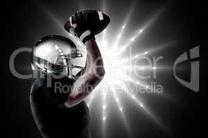 Composite image of porfile view ofamerican football player catch
