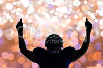 Composite image of silhouette american football player with thum