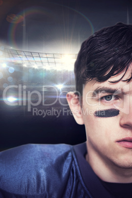 Composite image of american football player looking at the camer