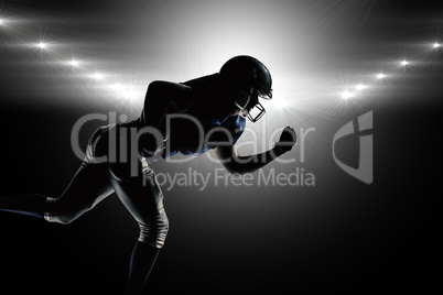 Composite image of silhouette american football player running