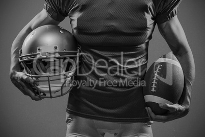 Composite image of midsection of american football player in red