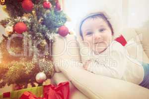 Cute baby boy on couch at christmas