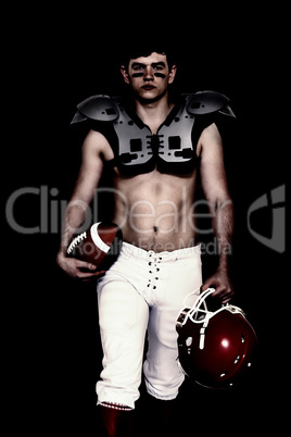 Composite image of american football player walking with a ball