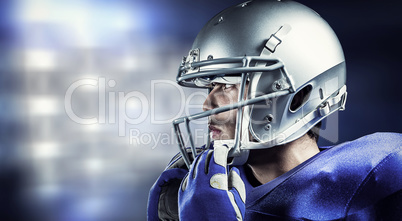 Composite image of sportsman wearing helmet looking away