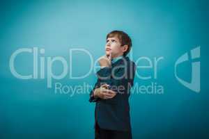 European appearance teenager boy in a business suit thoughtful h