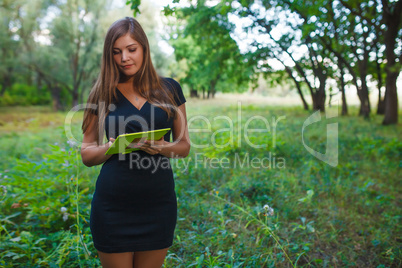 Girl European appearance young blond hair in a short black dress