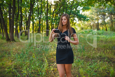Girl European appearance young brown-haired woman in a black dre