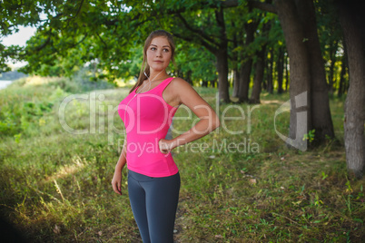 Girl European appearance young brown-haired woman in a pink shir