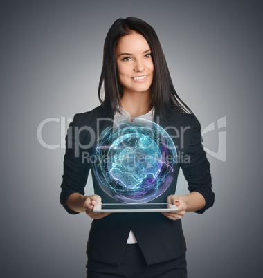 Young girl holding tablet in the hands of virtual digital world globe