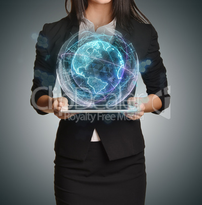 Young girl holding tablet in the hands of virtual digital globe