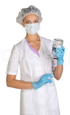 Female doctor picking up the syringe injection